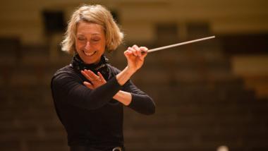 Conductor Nicole Paiement using a baton