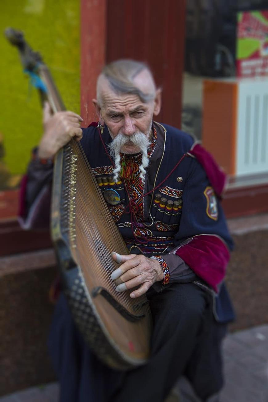 Ukrainian man playing the traditional bandura