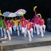 Latanya d. Tigner leads members of Dimensions Dance Theater in a second line parade